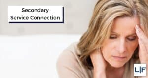 woman holding head thinking about secondary service connection